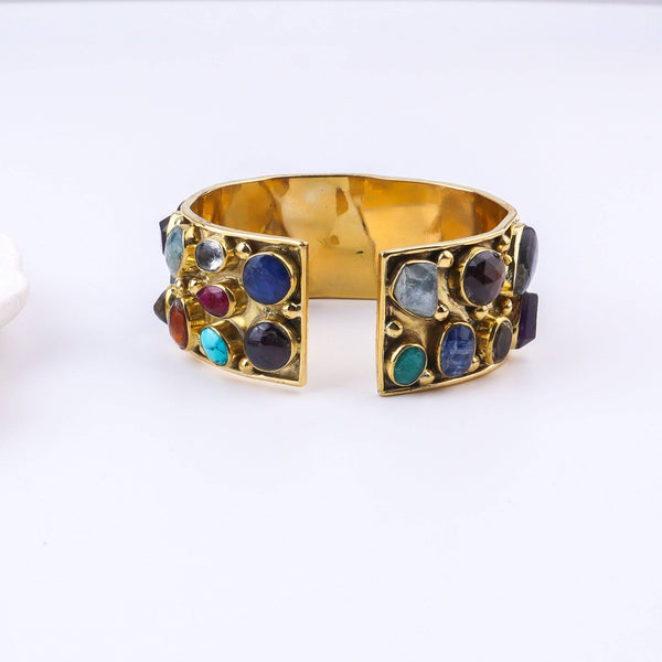 Detailed view of the brass fashion bracelet highlighting intricate motifs, textured surface, and refined brass finish