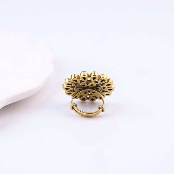 Angled view of the Brass Fashion Ring highlighting its distinctive shape, structure, and polished brass finish