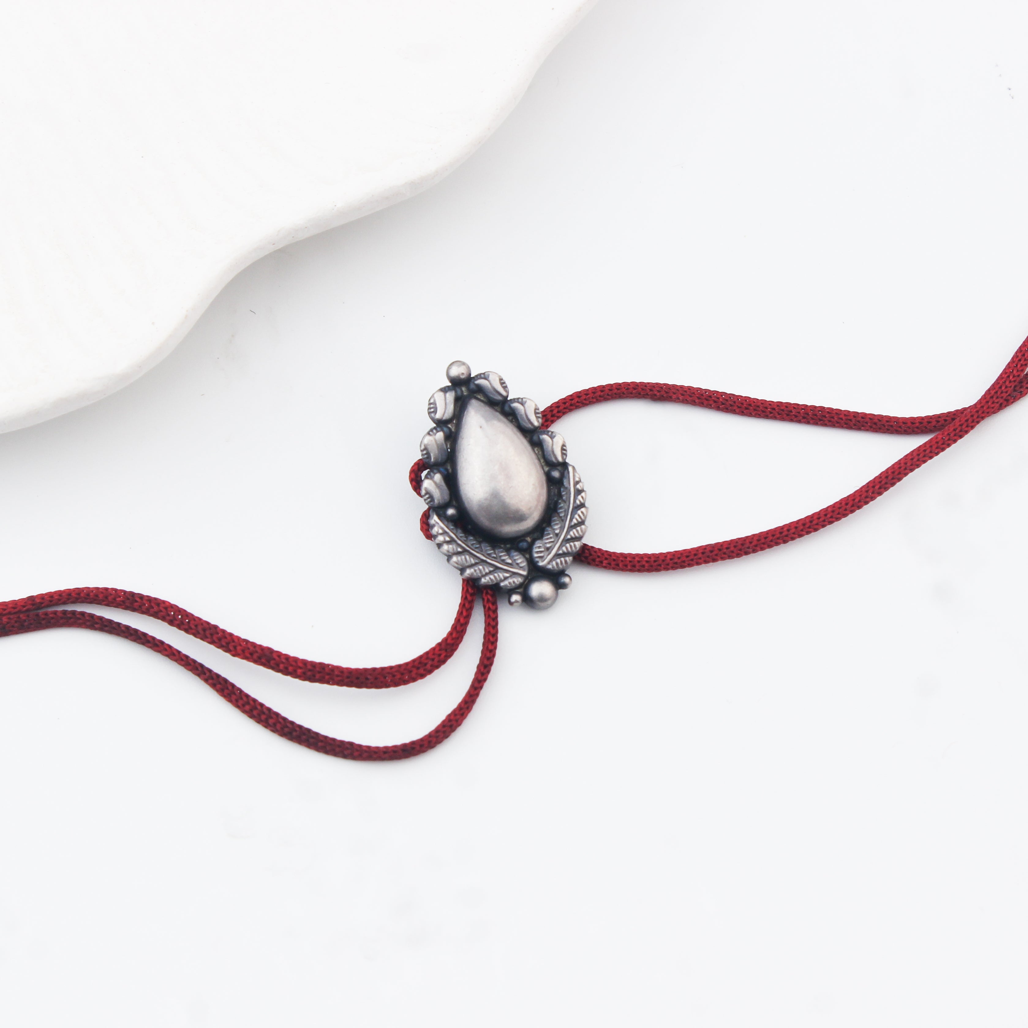 Handcrafted Silver Rakhi/Pendant: Drop