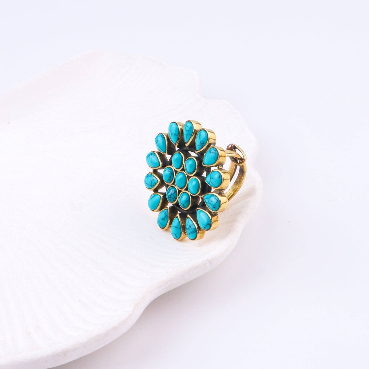 Angled view of the Brass Fashion Ring highlighting its distinctive shape, structure, and polished brass finish