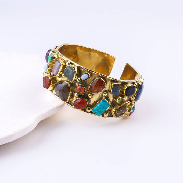 Detailed view of the brass fashion bracelet highlighting intricate motifs, textured surface, and refined brass finish