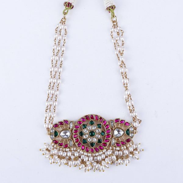 Angled view of a 22K gold-plated fashion necklace highlighting its elegant structure, unique design, and polished gold finish