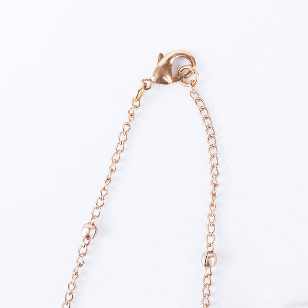 Angled view of the 22K gold-plated fashion set highlighting its coordinated design, elegant structure, and polished gold finish
