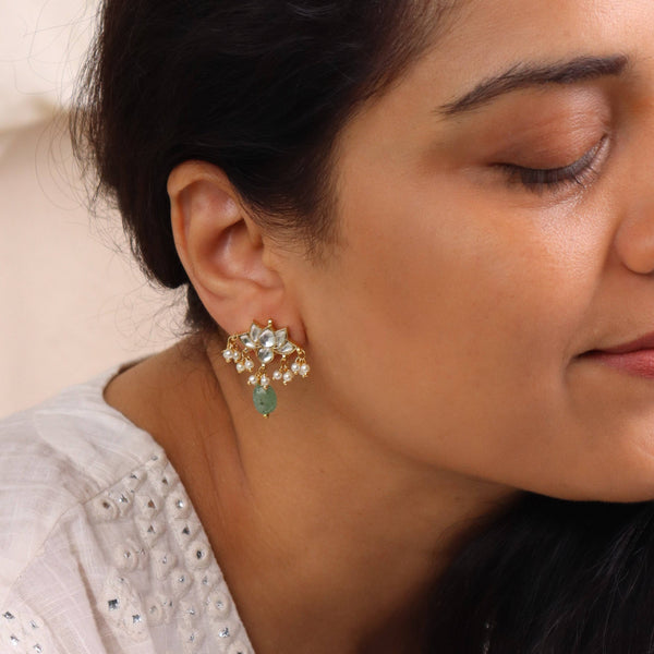 Model styling 22K gold-plated fashion earring with an elegant ethnic outfit for a graceful festive jewellery look