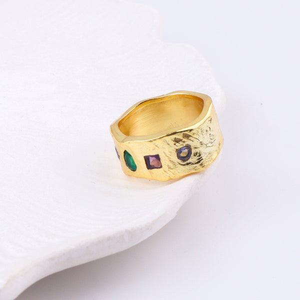 Close-up of a brass fashion ring showcasing intricate detailing, unique design, and fine craftsmanship