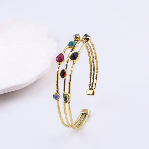 Angled view of the Brass Fashion Bracelet highlighting its unique silhouette, structure, and polished brass finish