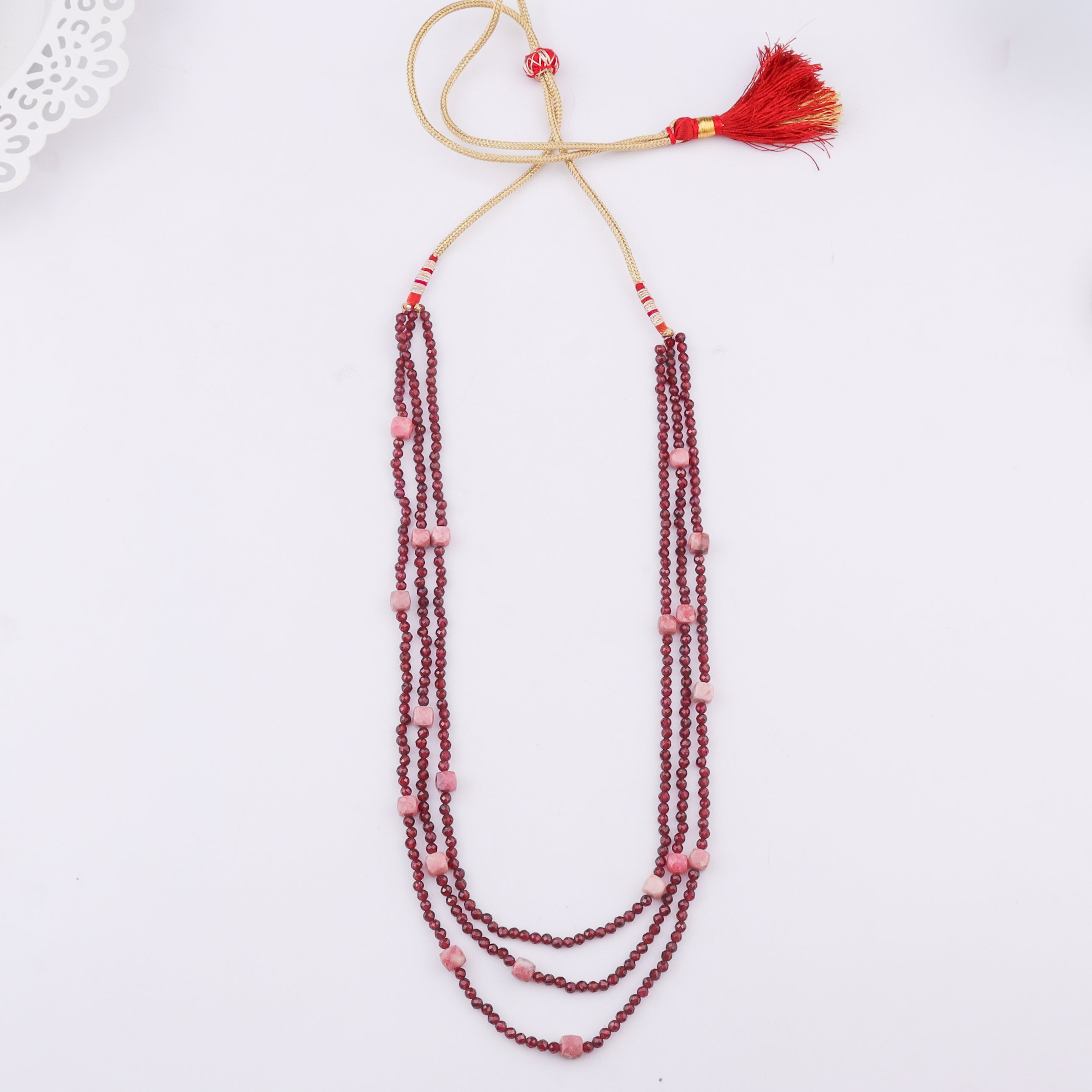 Red beaded layered necklace with pink beads and tassel
