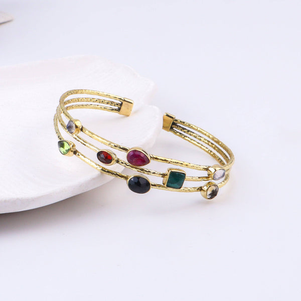 Detailed view of the brass fashion bracelet highlighting intricate motifs, textured surface, and refined brass finish