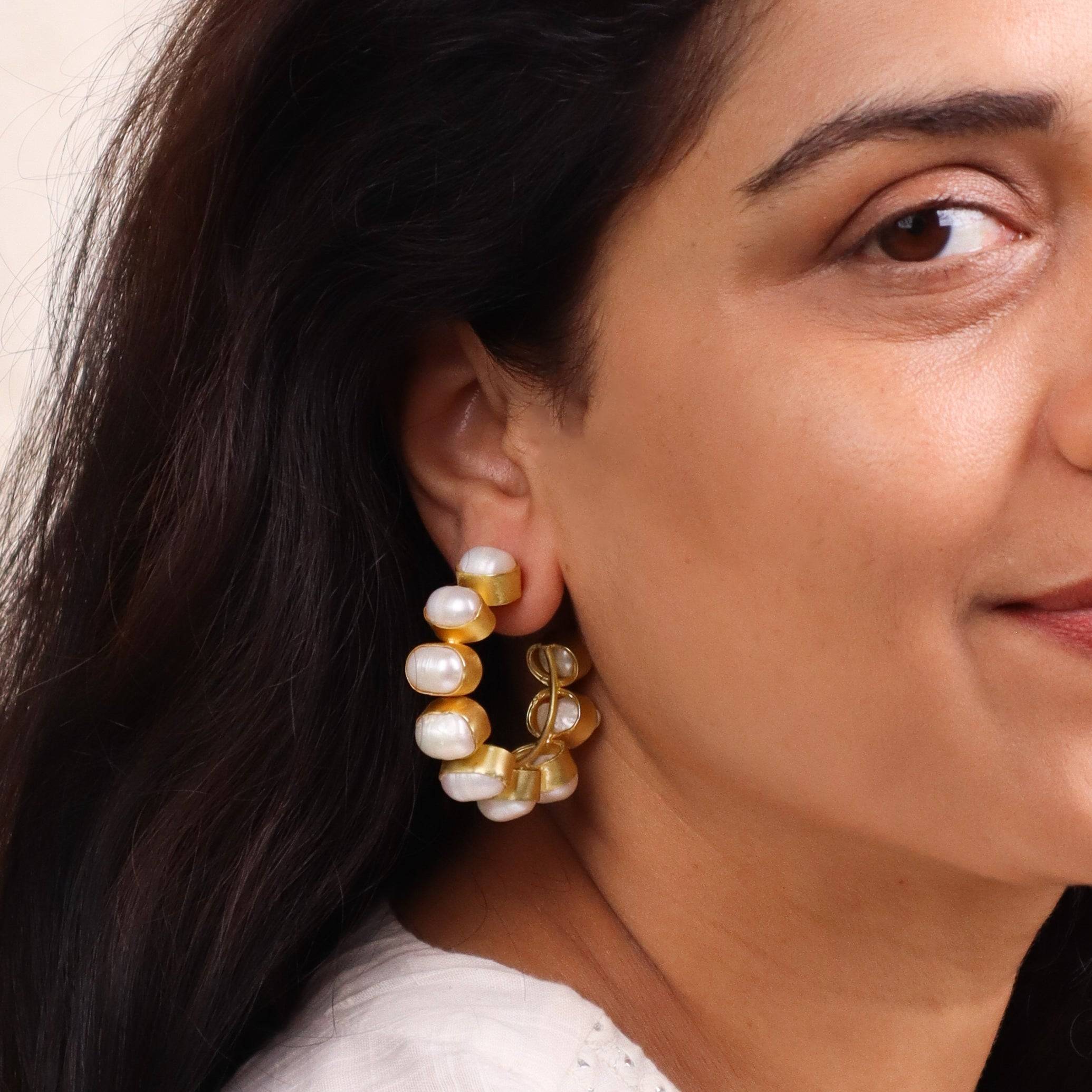 Model wearing 22K gold-plated fashion earrings for a sophisticated and contemporary jewelry look