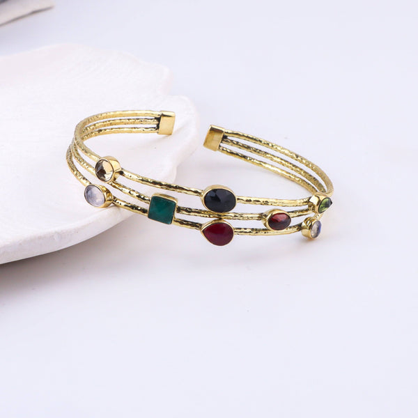 Detailed view of the brass fashion bracelet highlighting intricate motifs, textured surface, and refined brass finish