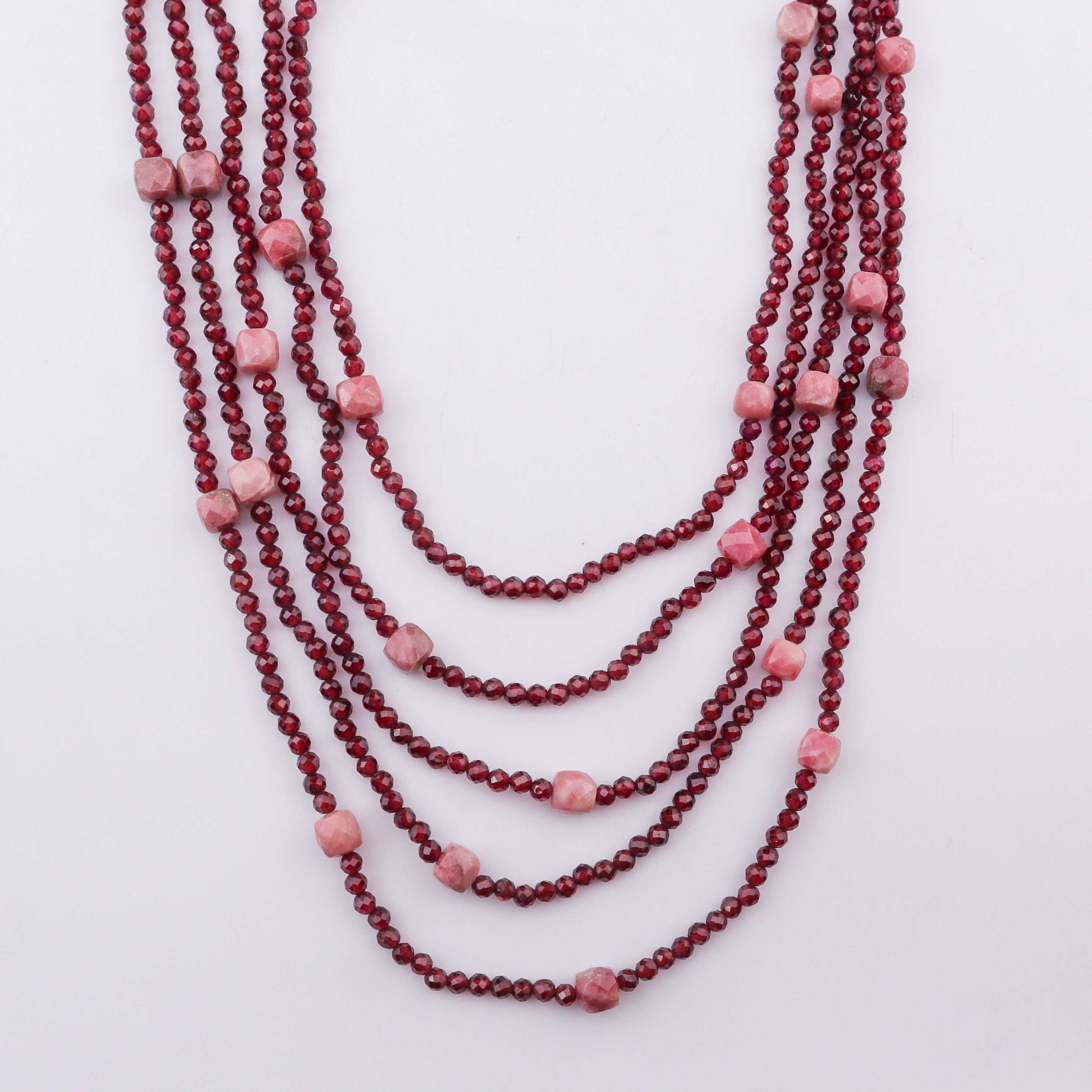 Multi-layer red beaded necklace with pink gemstone accents, jewelry accessory