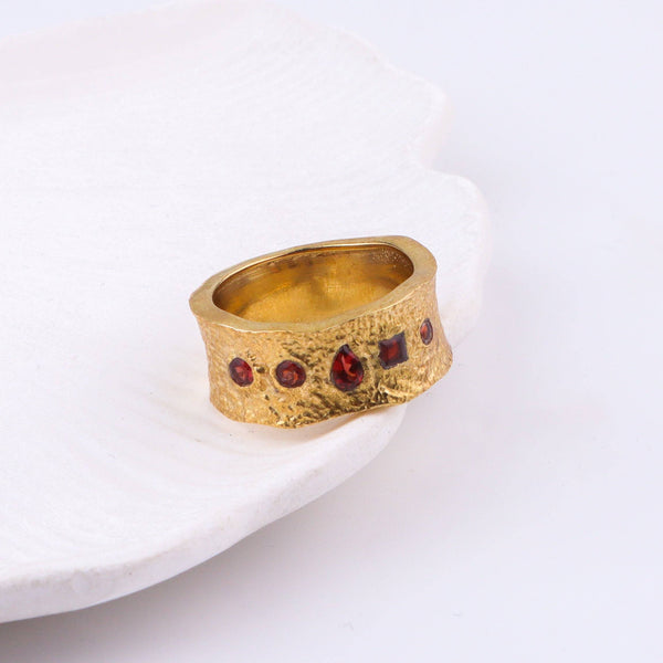 Close-up of a brass fashion ring showcasing intricate detailing, unique design, and fine craftsmanship