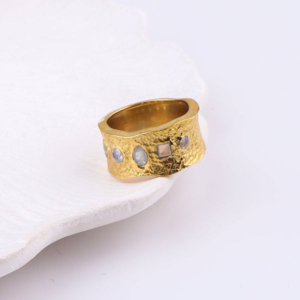 Close-up of a brass fashion ring showcasing intricate detailing, unique design, and fine craftsmanship