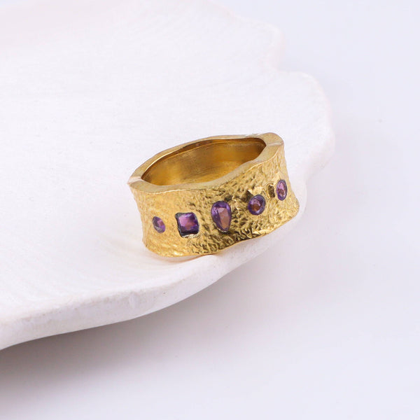 Close-up of a brass fashion ring showcasing intricate detailing, unique design, and fine craftsmanship
