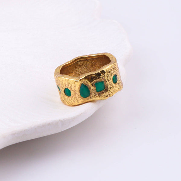 Close-up of a brass fashion ring showcasing intricate detailing, unique design, and fine craftsmanship