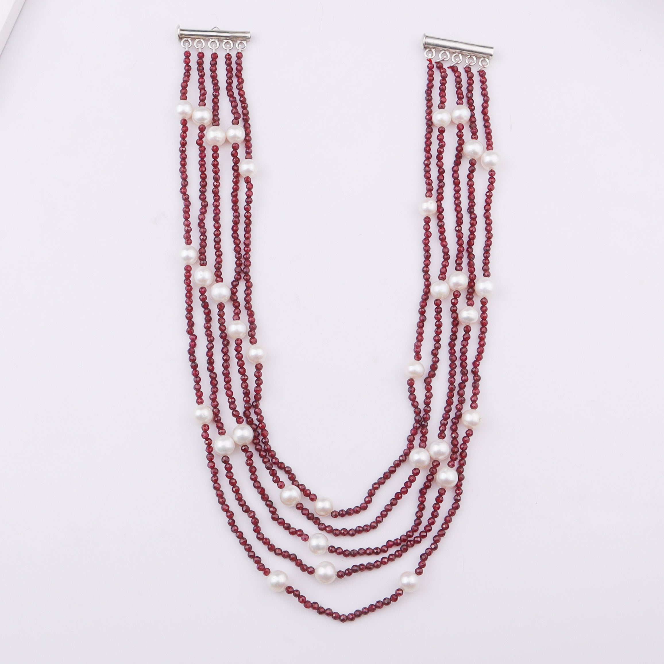 Multi-layer red beaded necklace with white pearls
