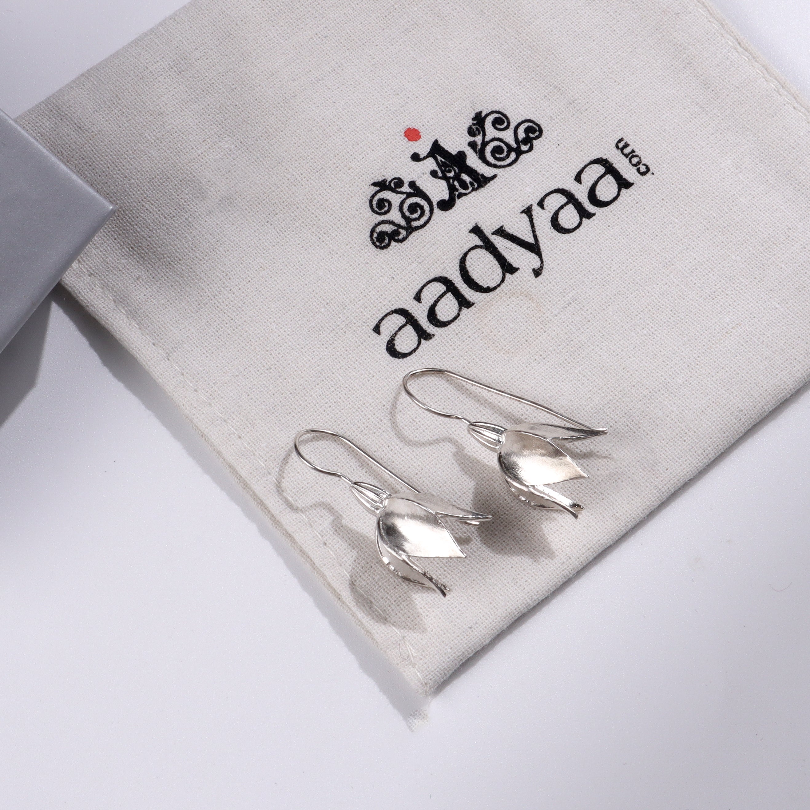Sterling silver snowflake earrings on Aadyaa jewelry pouch