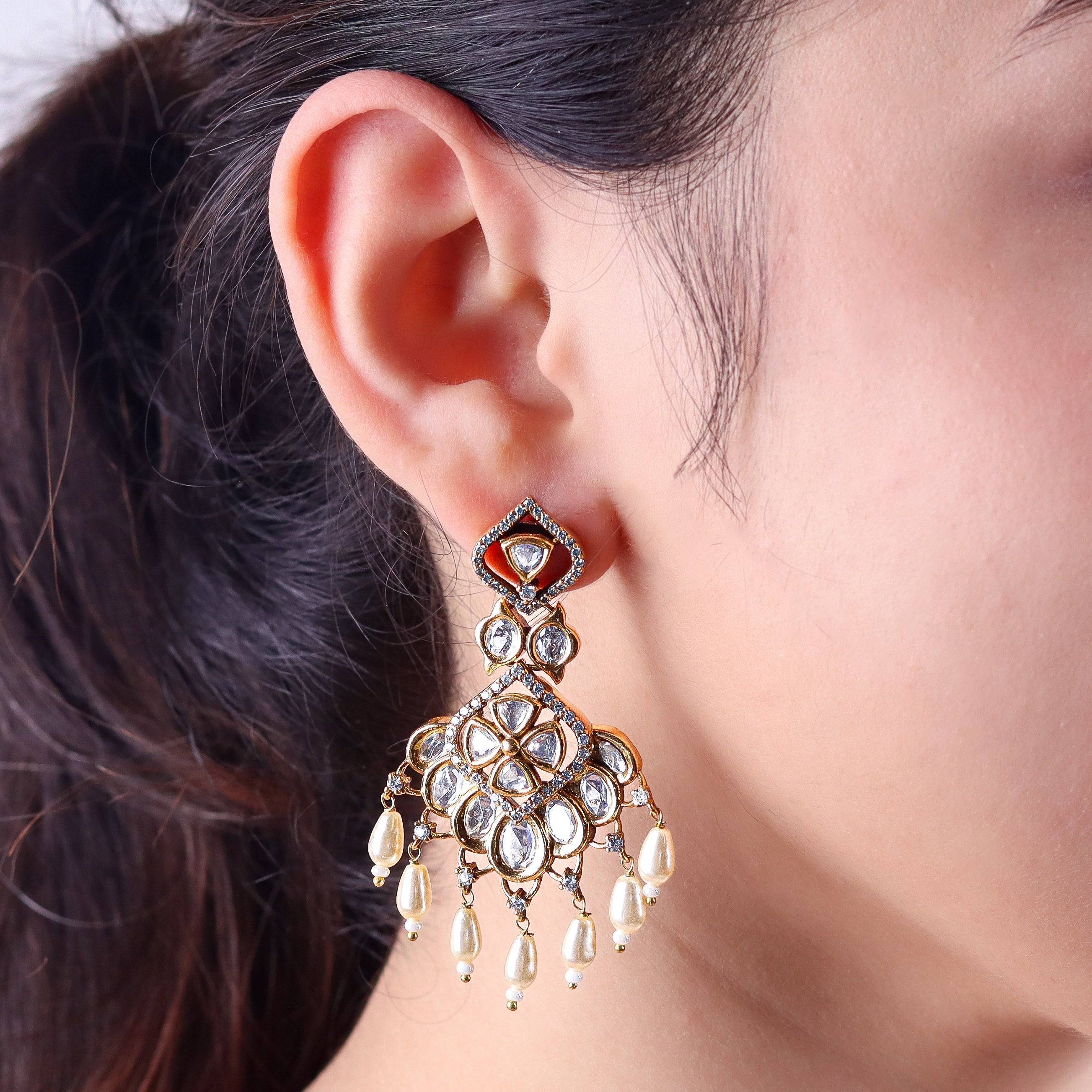 Model wearing a 22K gold-plated fashion earring for a sophisticated and contemporary jewelry look