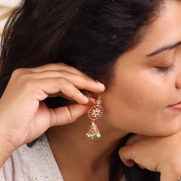 Model styling 22K gold-plated fashion earring with an elegant ethnic outfit for a graceful festive jewellery look