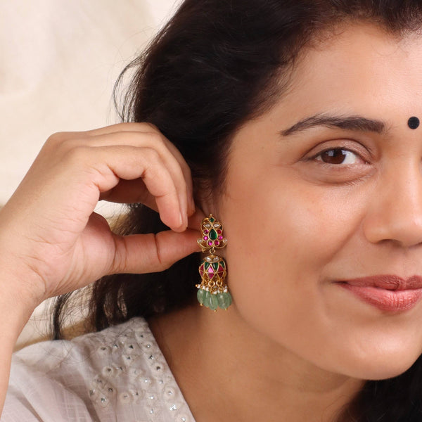 Model wearing 22K gold-plated fashion earrings for a sophisticated and contemporary jewelry look