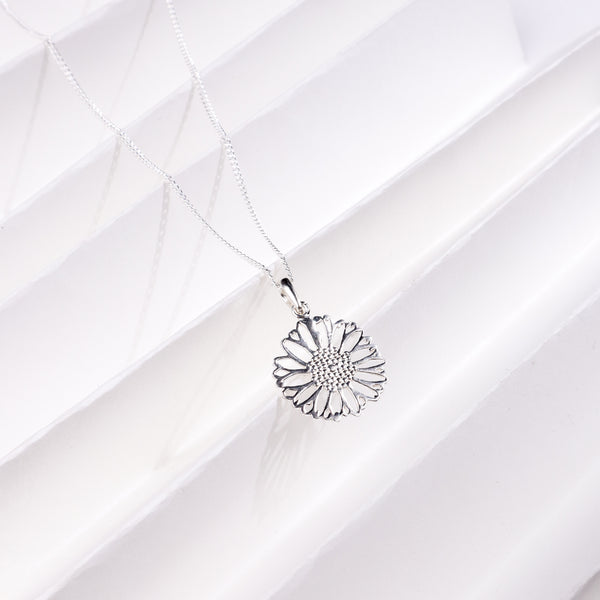 Silver floral pendant necklace