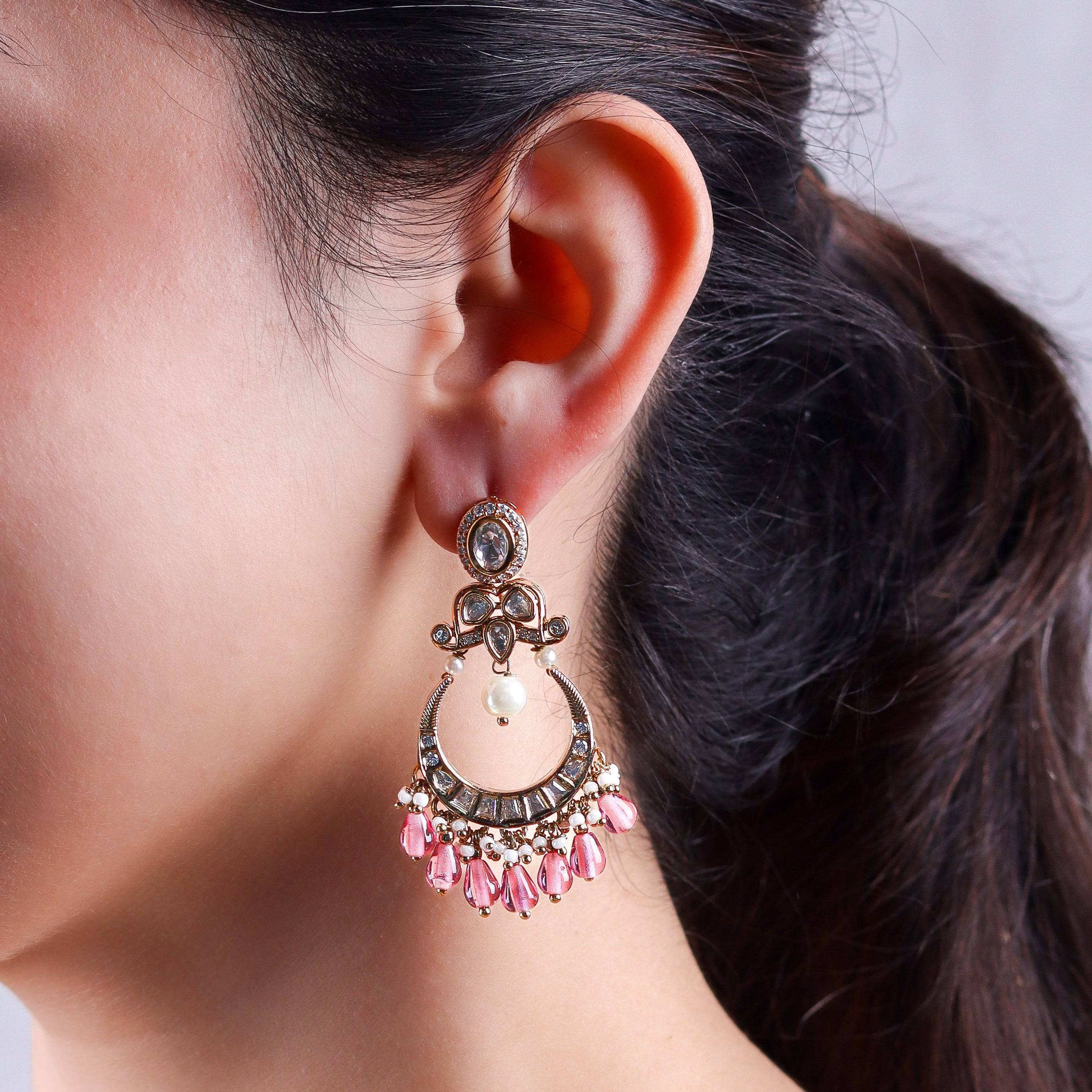 Model wearing a 22K gold-plated fashion earring for a sophisticated and contemporary jewelry look