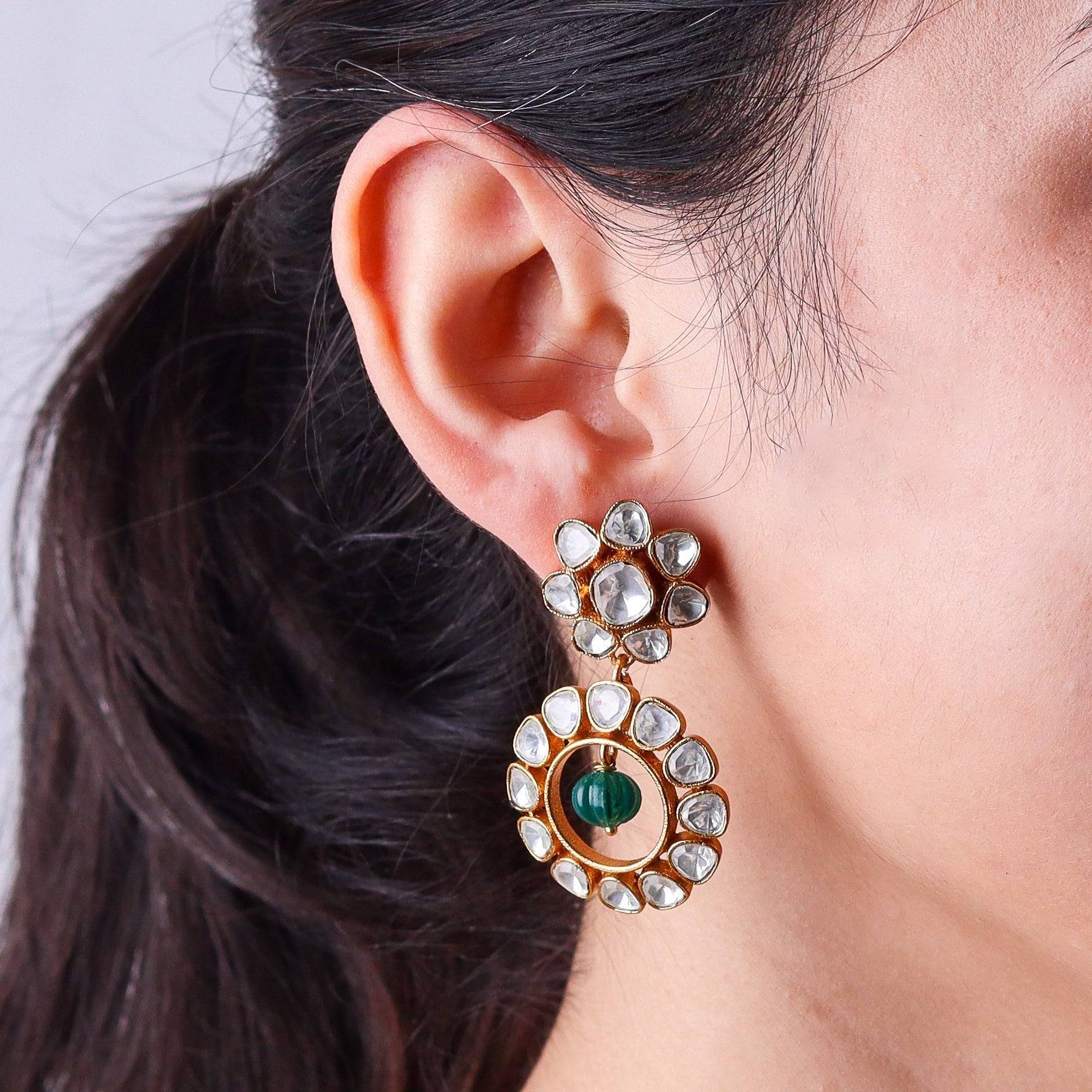 Model wearing a 22K gold-plated fashion earring for a sophisticated and contemporary jewelry look