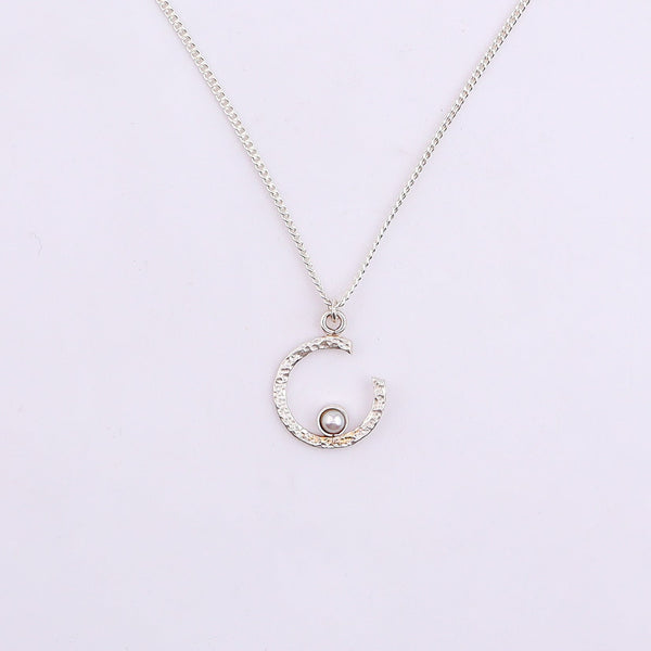 Silver semi-circle pearl necklace with modern design