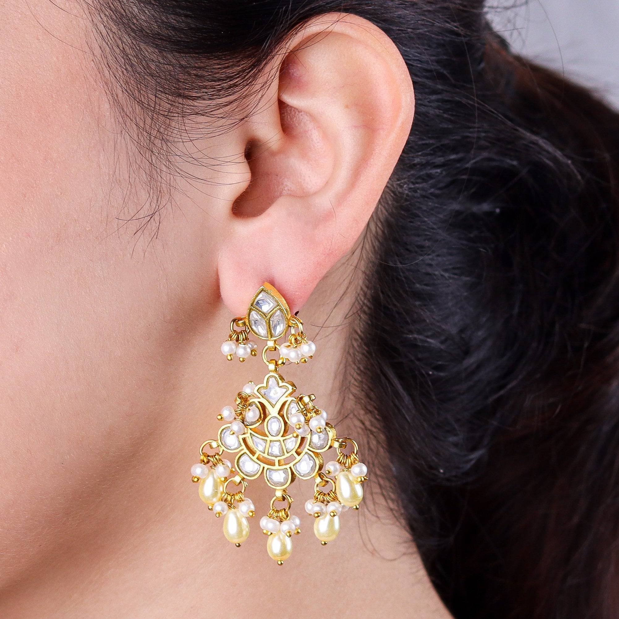 Model wearing a 22K gold-plated fashion earring for a sophisticated and contemporary jewelry look