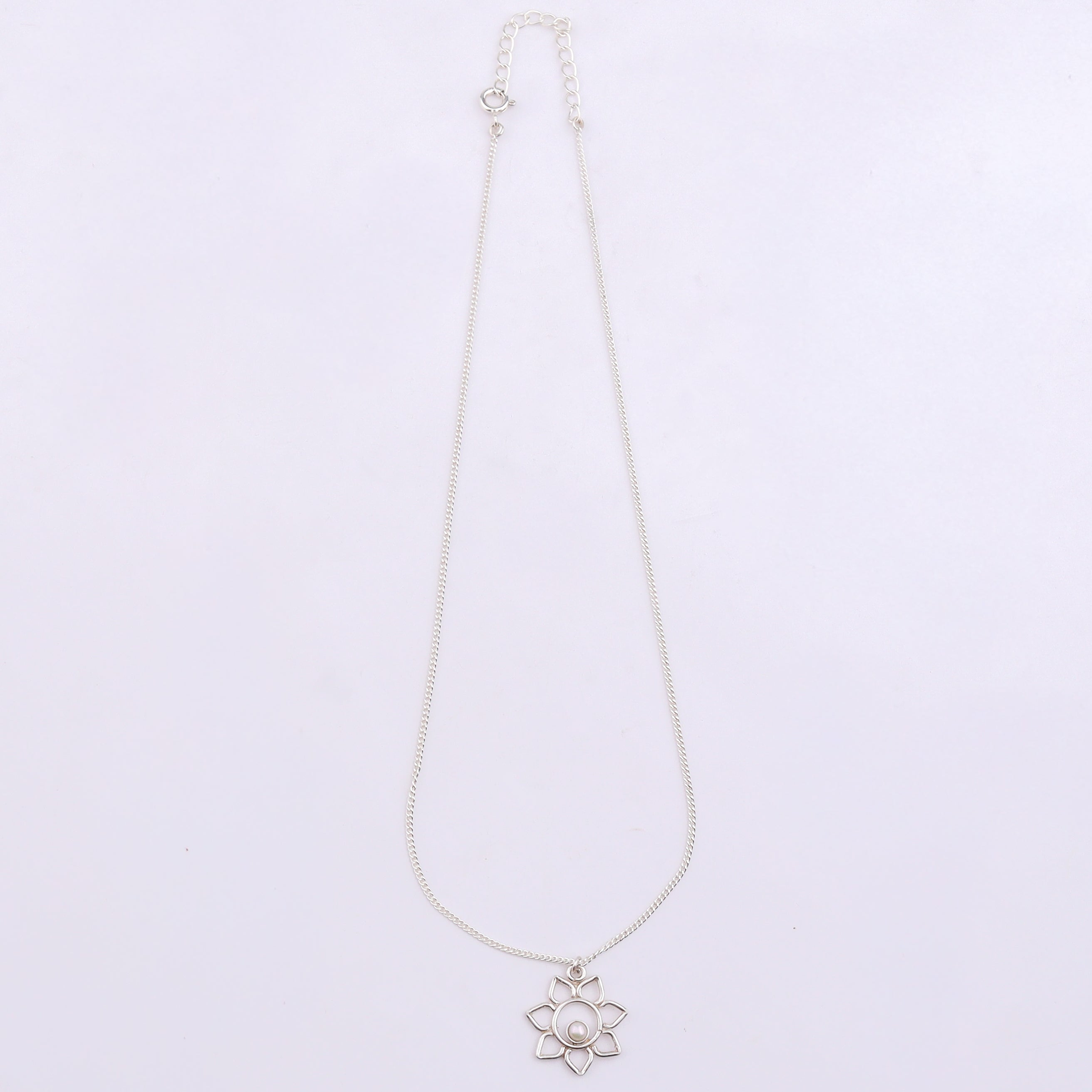 Silver chain necklace with flower pendant and pearl detail