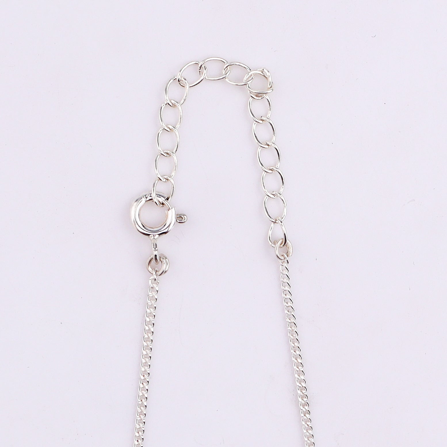 Silver chain necklace with adjustable clasp and flower pendant