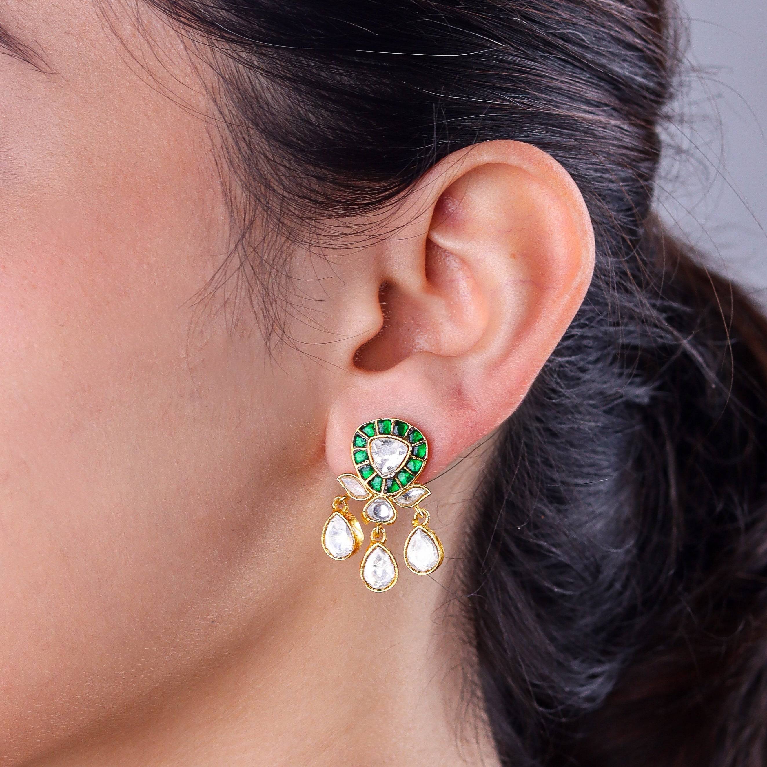 Model wearing a 22K gold-plated fashion earring for a sophisticated and contemporary jewelry look