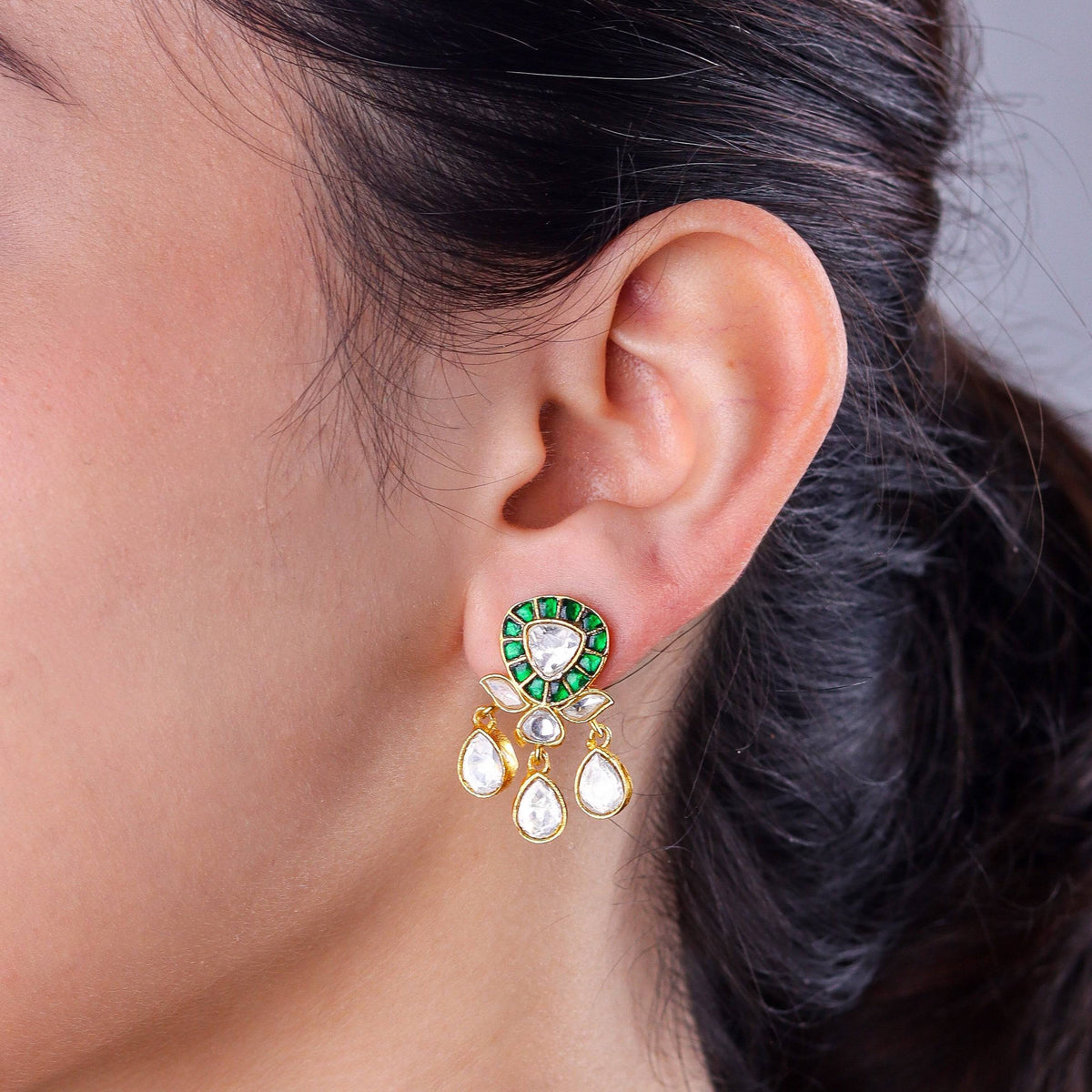 Model wearing a 22K gold-plated fashion earring for a sophisticated and contemporary jewelry look