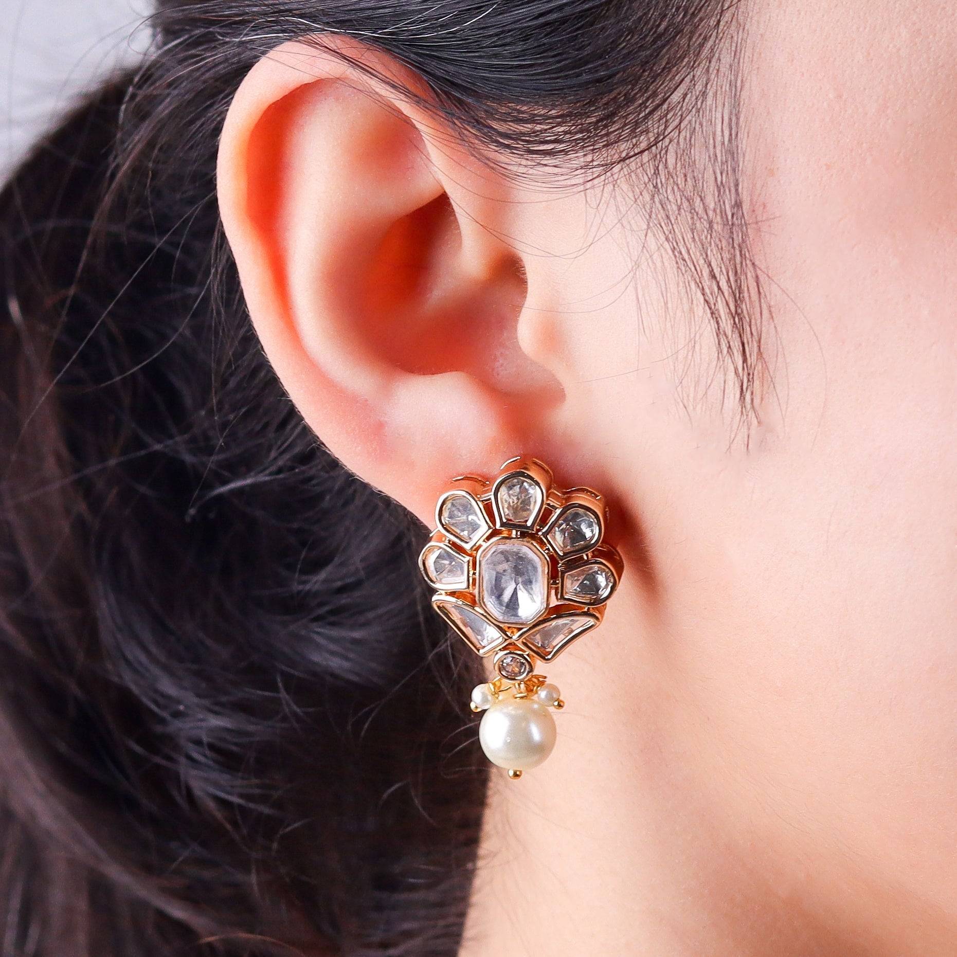 Model wearing a 22K gold-plated fashion earring for a sophisticated and contemporary jewelry look