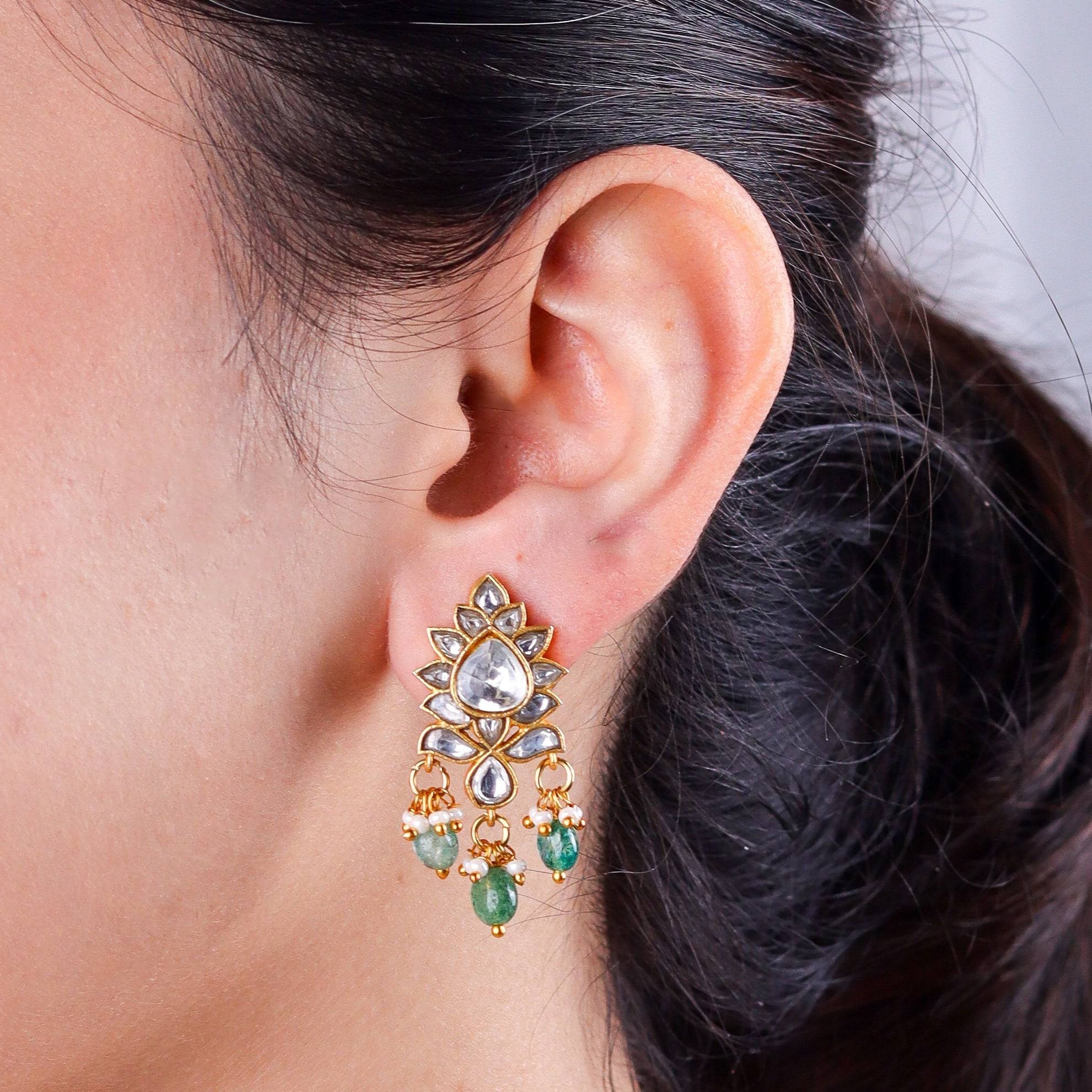 Model wearing a 22K gold-plated fashion earring for a sophisticated and contemporary jewelry look