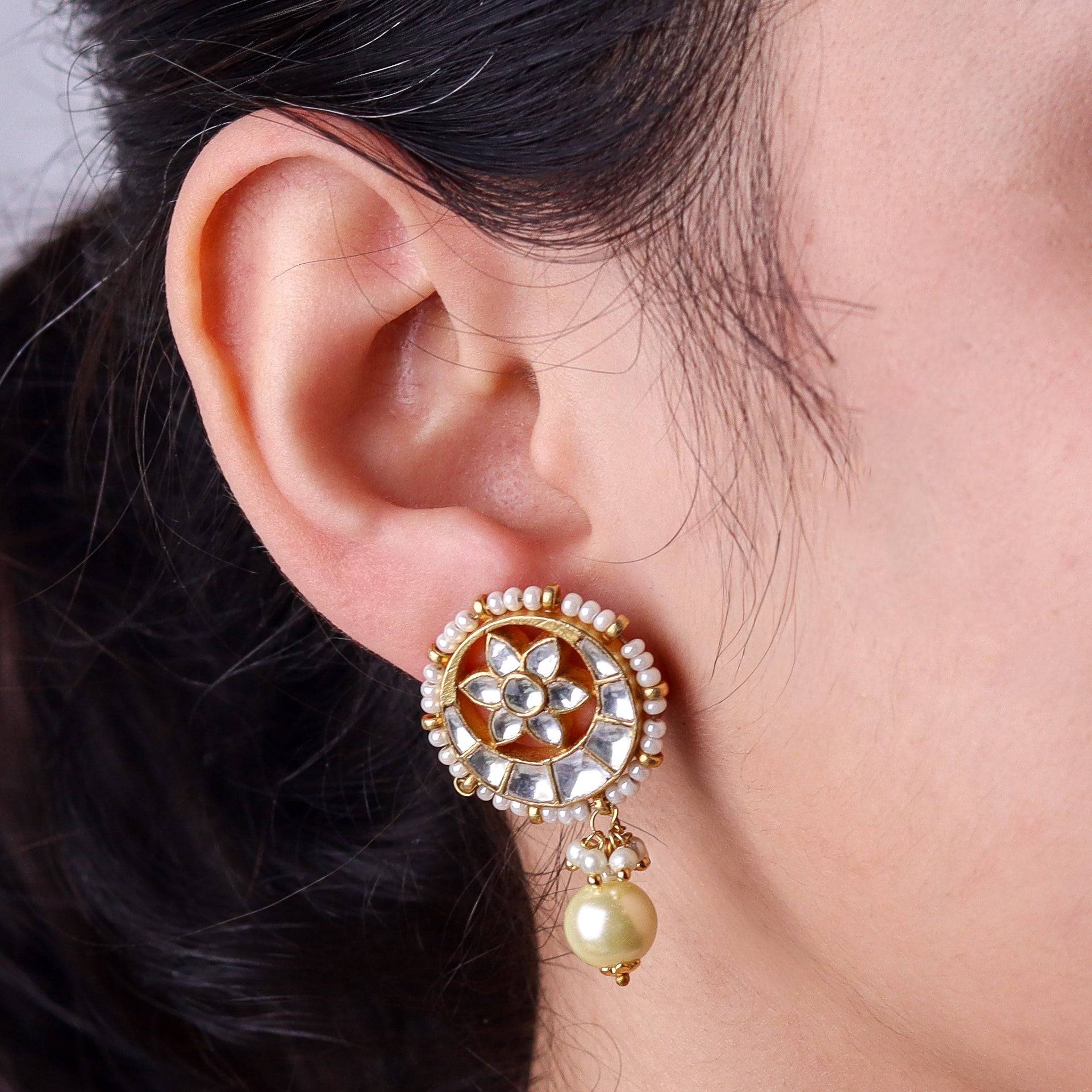 Model wearing a 22K gold-plated fashion earring for a sophisticated and contemporary jewelry look