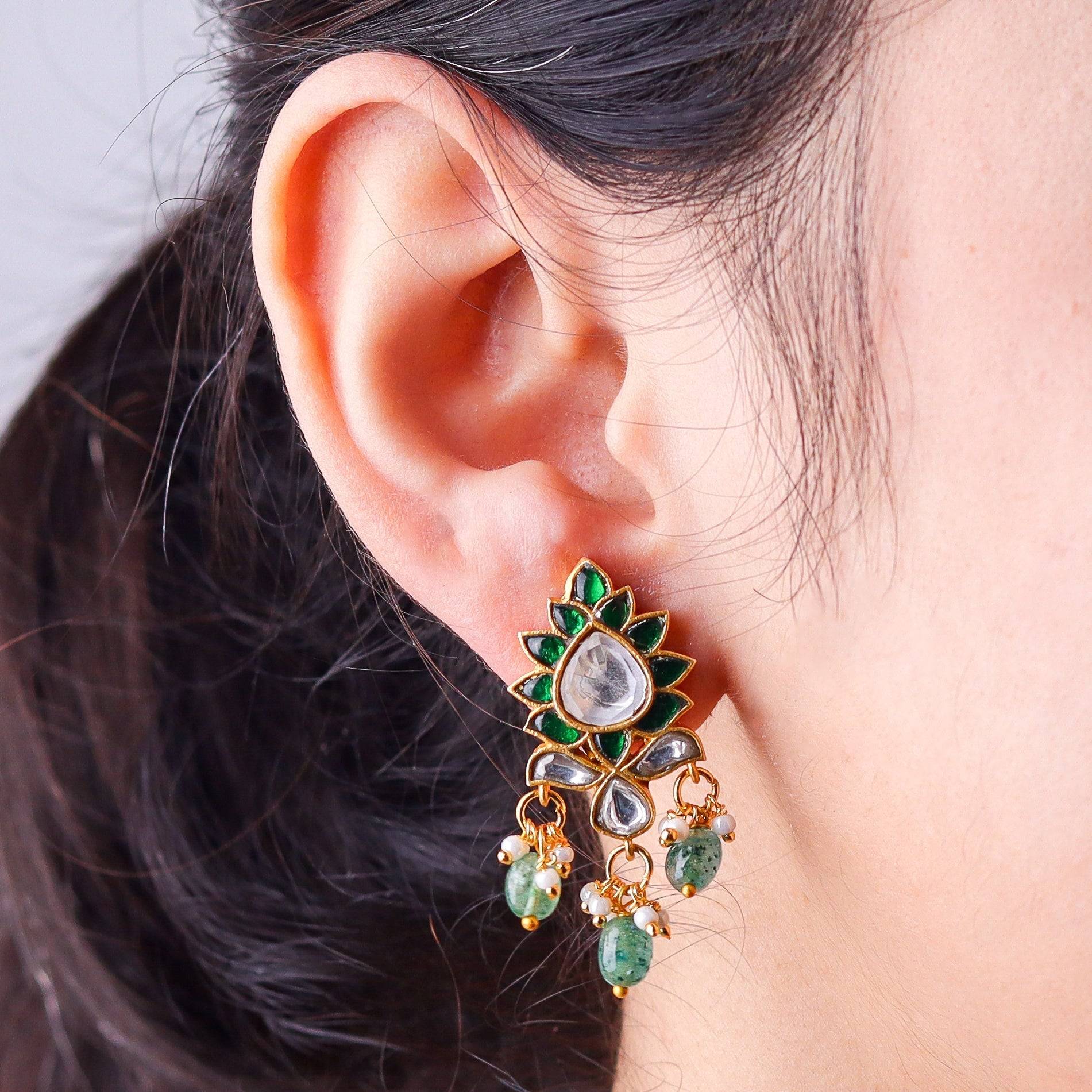 Model wearing a 22K gold-plated fashion earring for a sophisticated and contemporary jewelry look