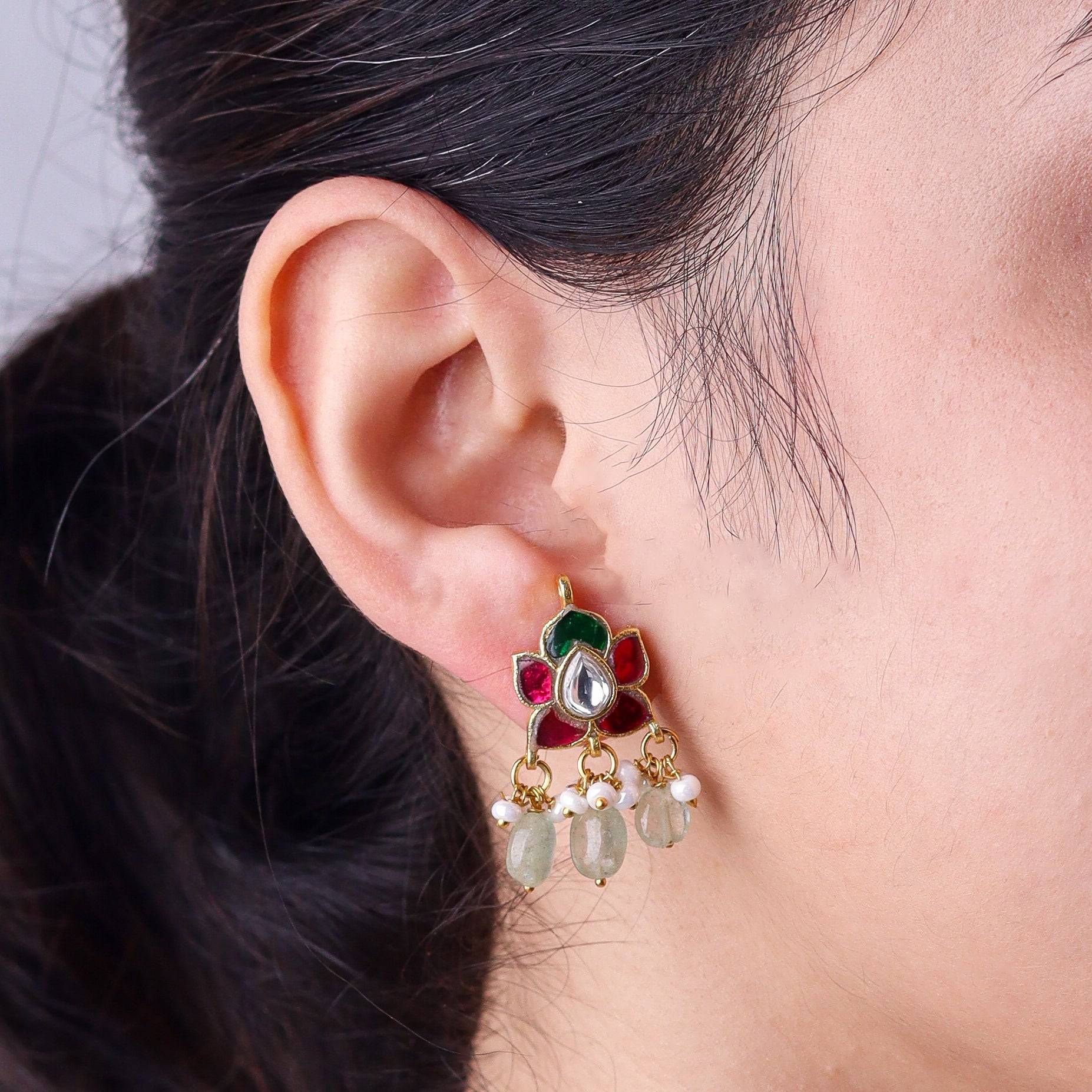 Model wearing a 22K gold-plated fashion earring for a sophisticated and contemporary jewelry look