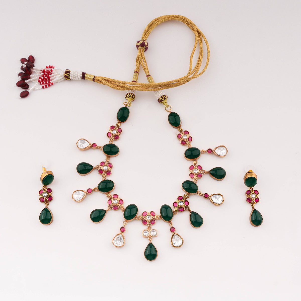 Detailed view of 22K gold-plated fashion set highlighting intricate motifs, textured detailing, and premium 22K gold-plated finish