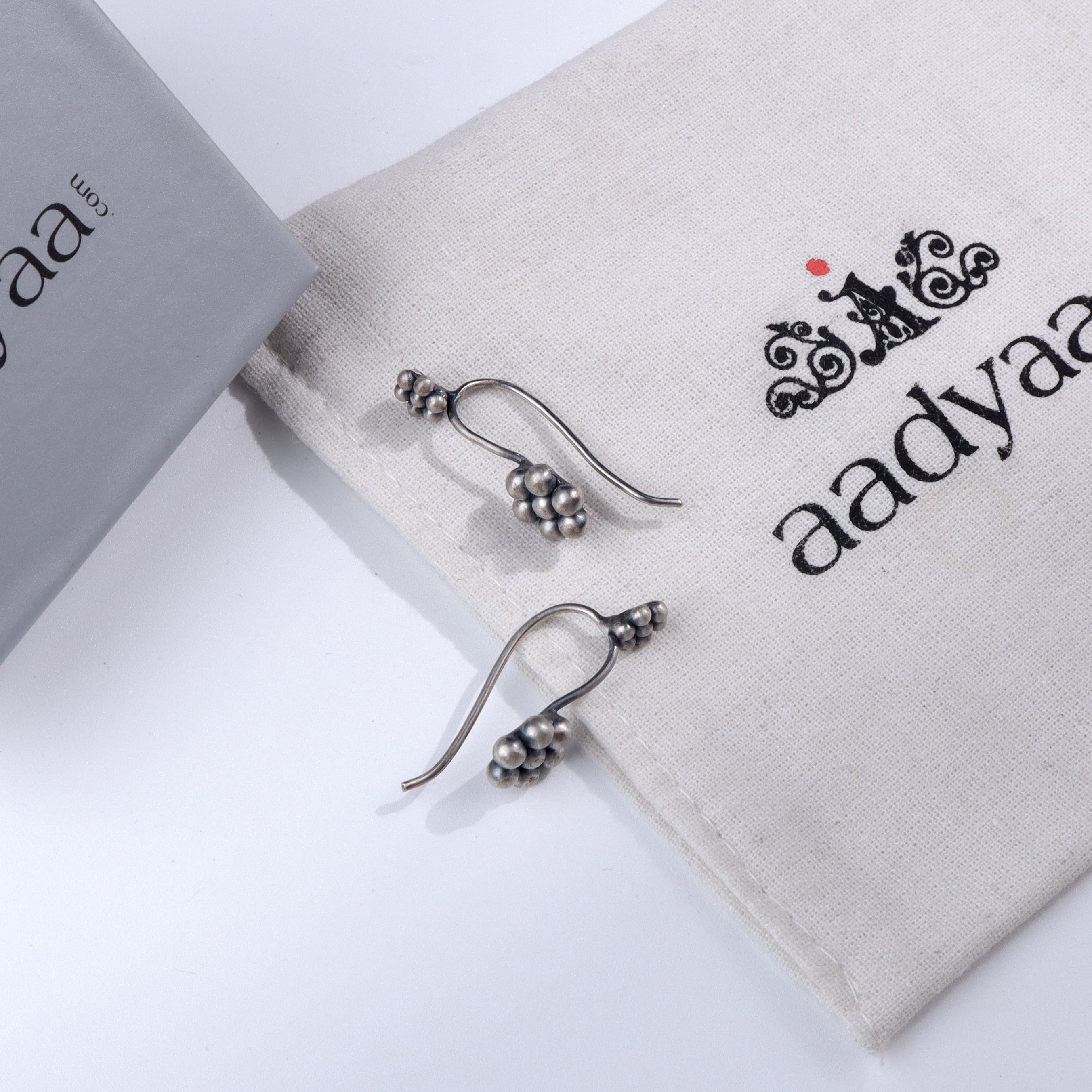 Silver Kudi Bugadi earrings with traditional design and polished finish