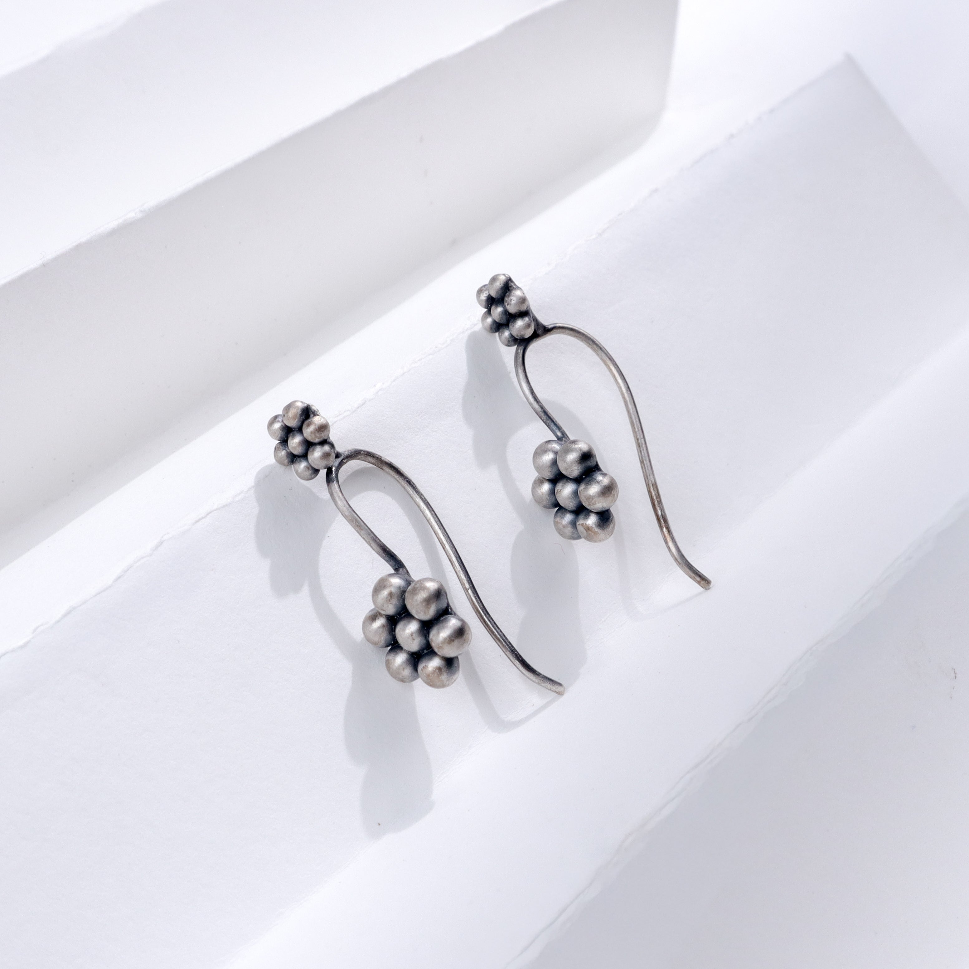 Silver Kudi Bugadi earrings with cluster design, handcrafted sterling silver jewelry for festive occasions