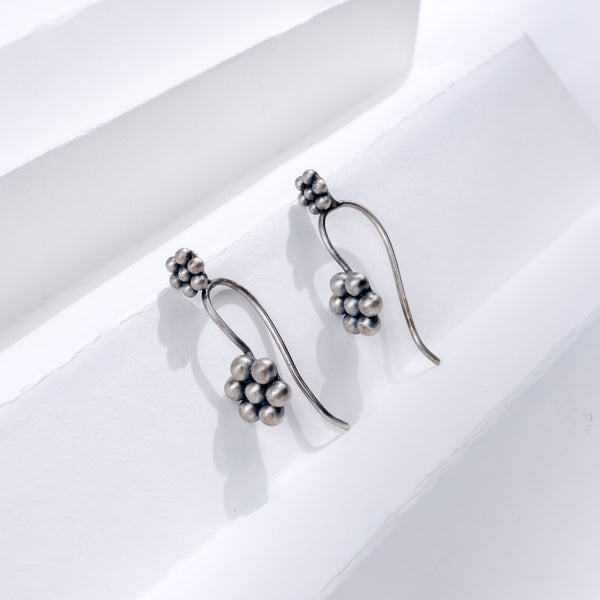 Silver Kudi Bugadi earrings with cluster design, handcrafted sterling silver jewelry for festive occasions