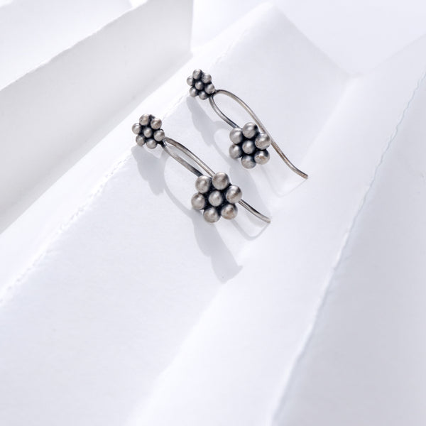 Silver Kudi Bugadi earrings with floral design, handcrafted sterling silver jewelry for festive occasions