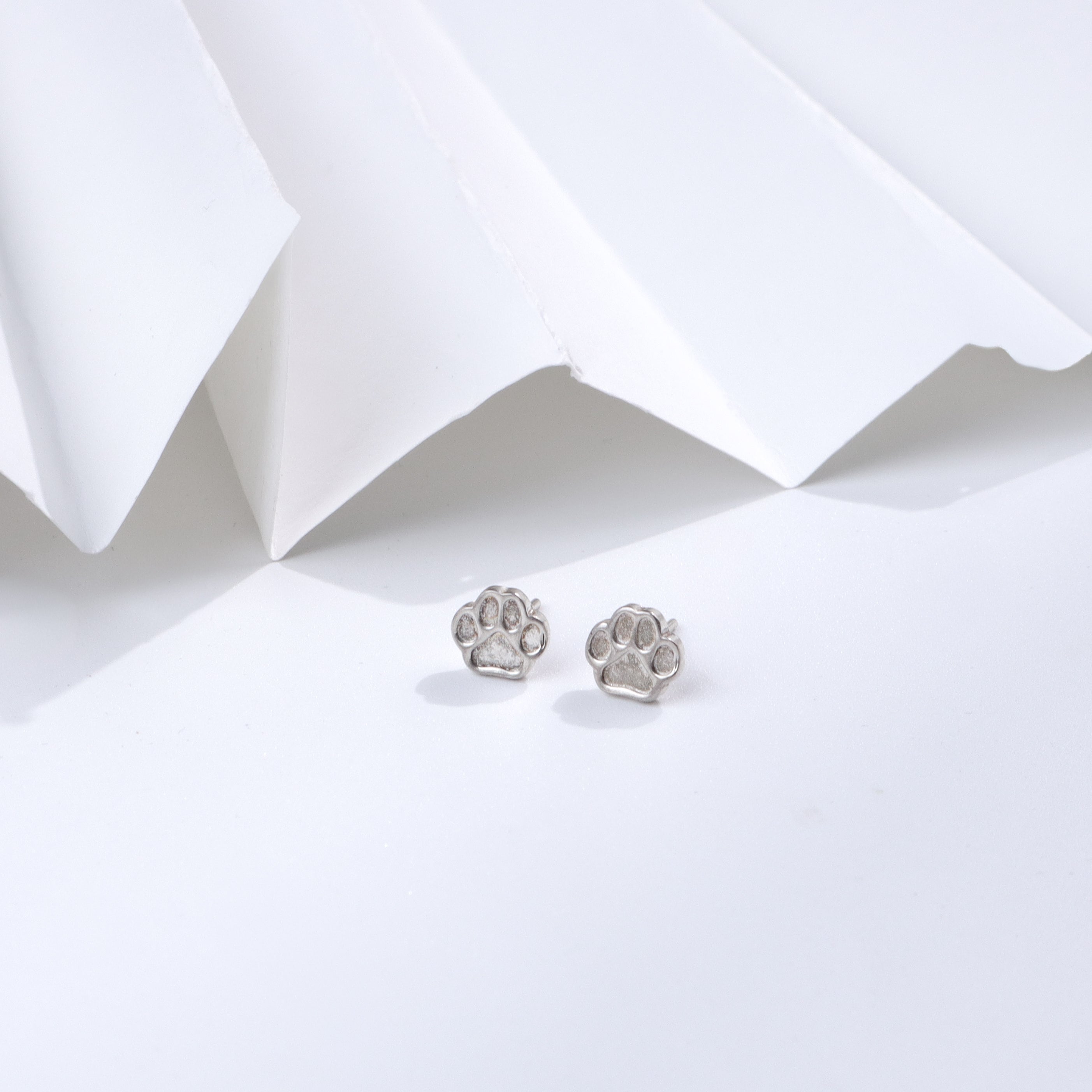 Silver paw stud earrings for pet lovers