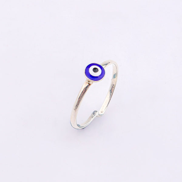 Silver evil eye ring on white background