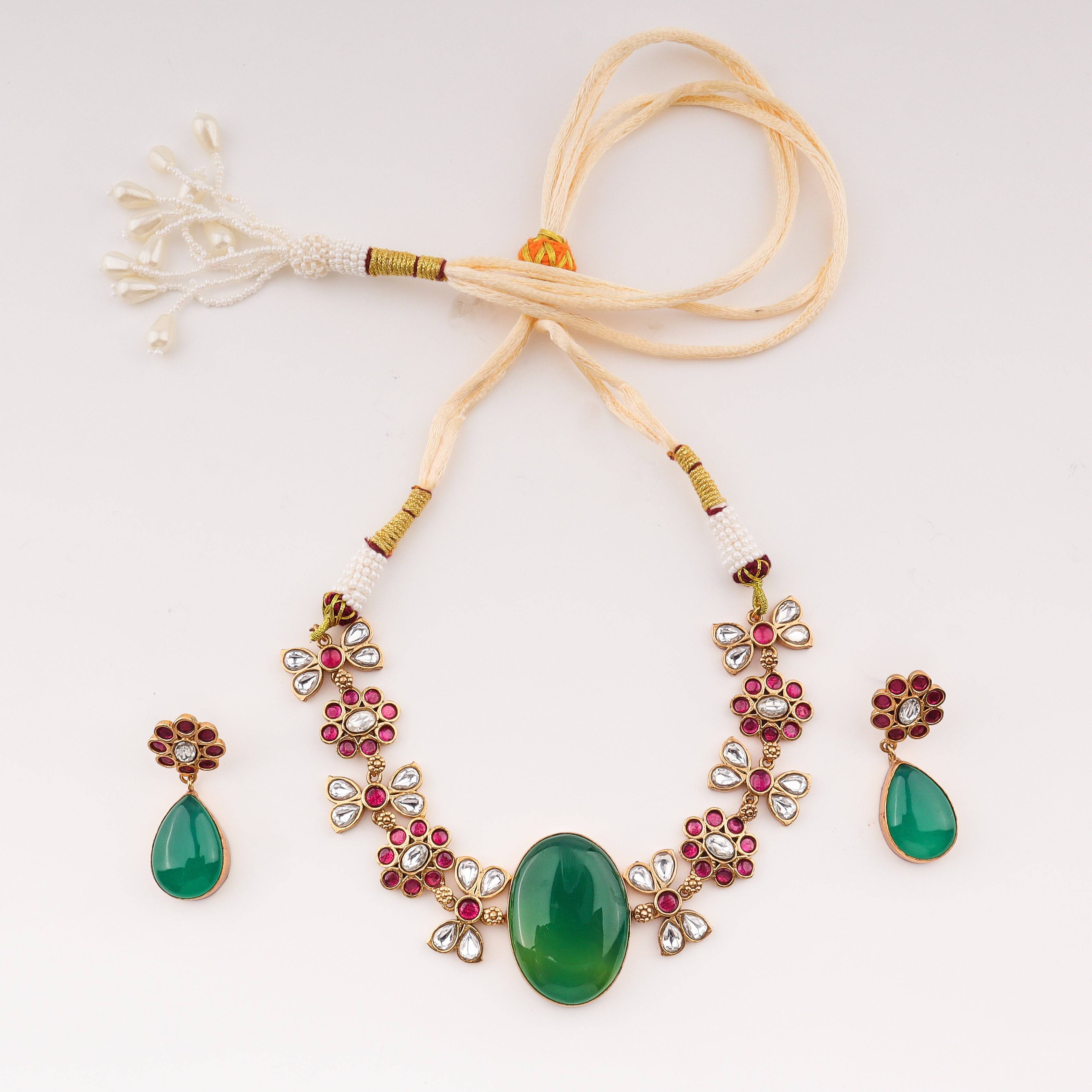 Detailed view of 22K gold-plated fashion set highlighting intricate motifs, textured detailing, and premium 22K gold-plated finish