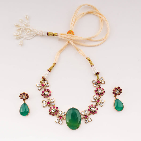 Detailed view of 22K gold-plated fashion set highlighting intricate motifs, textured detailing, and premium 22K gold-plated finish