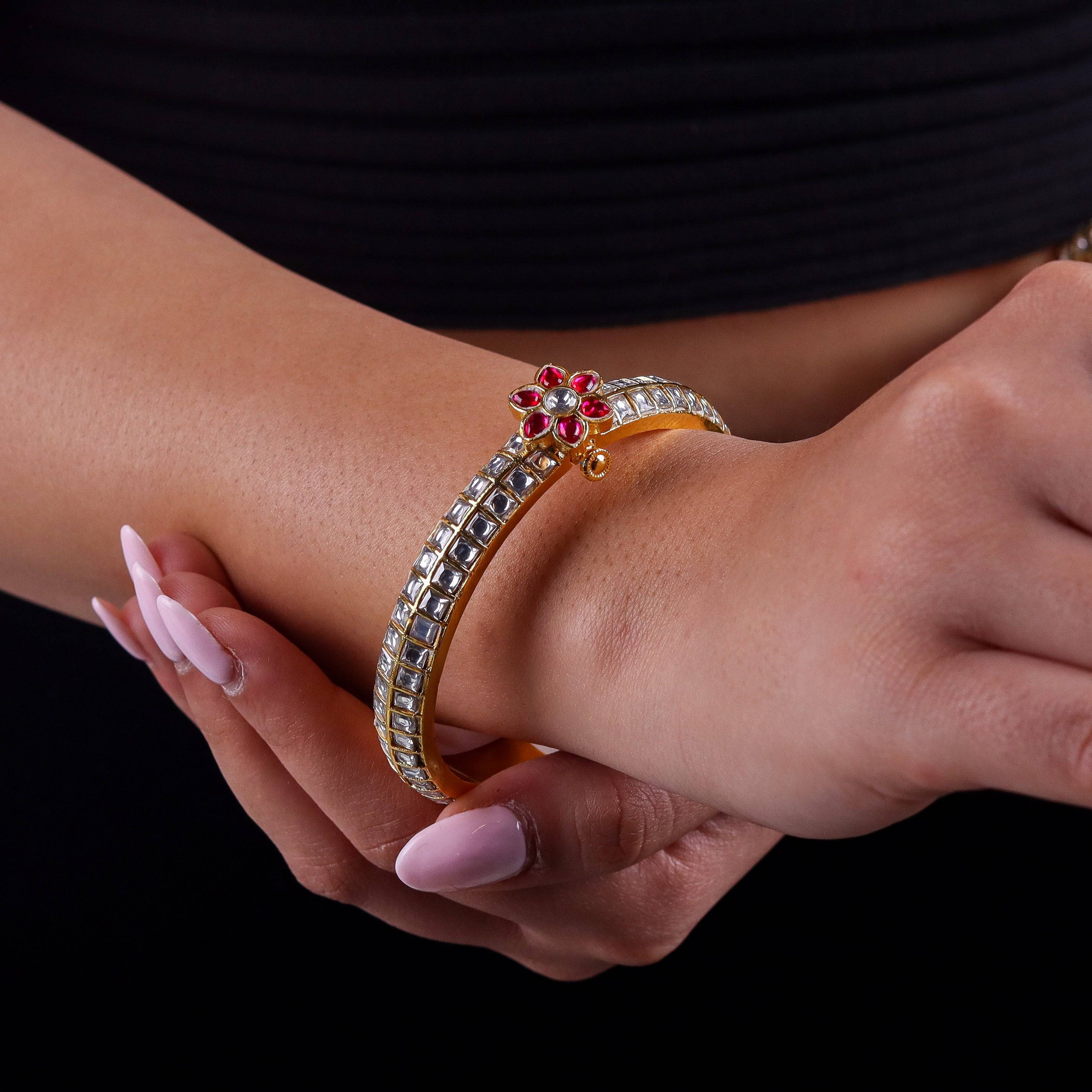 Model wearing a 22K gold-plated fashion bangle (single) for a sophisticated and elegant jewelry look