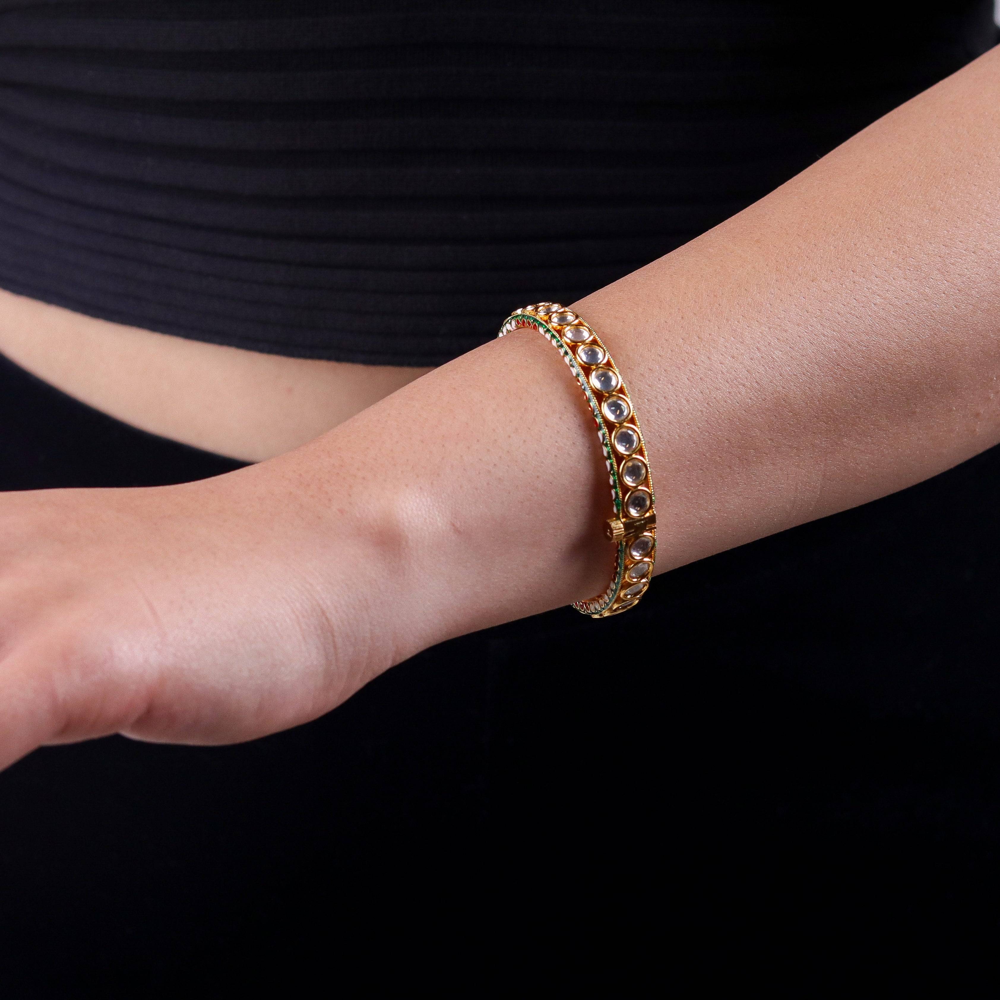 Model wearing a 22K gold-plated fashion bangle (single) for a sophisticated and elegant jewelry look
