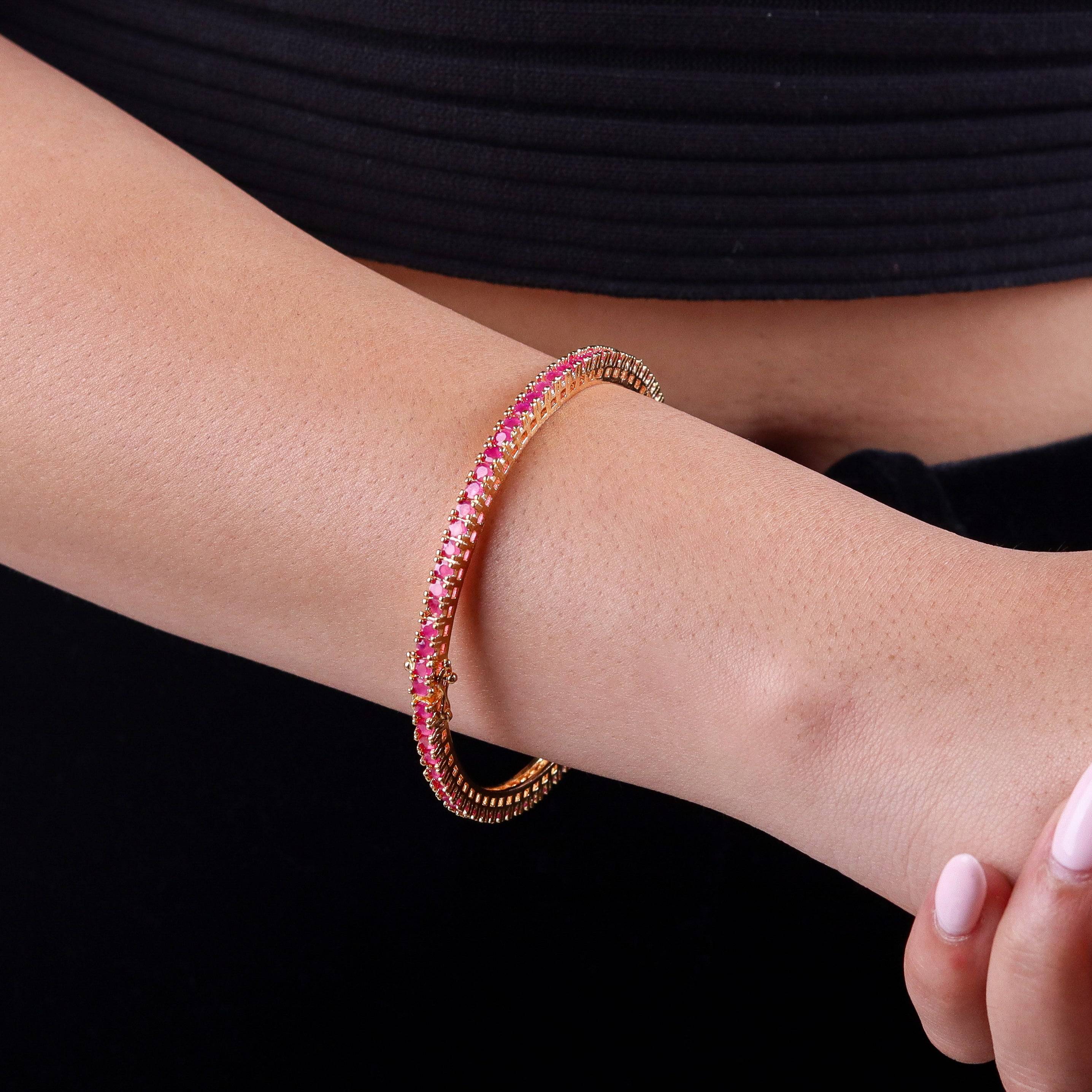 Model wearing a 22K gold-plated fashion bangle (single) for a sophisticated and elegant jewelry look